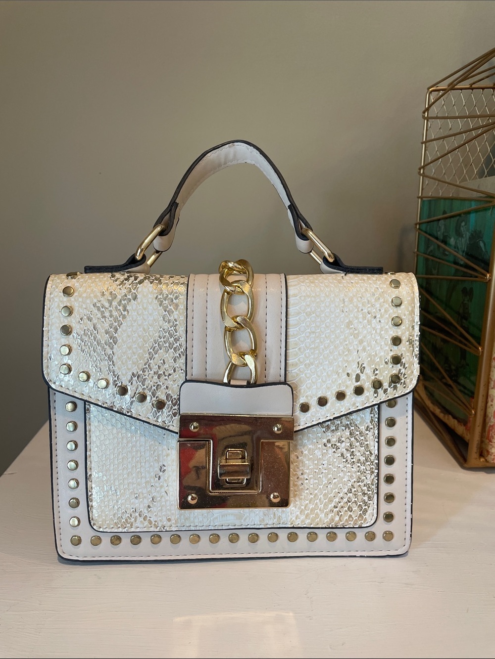 Faux snakeskin cream with gold accents bag
